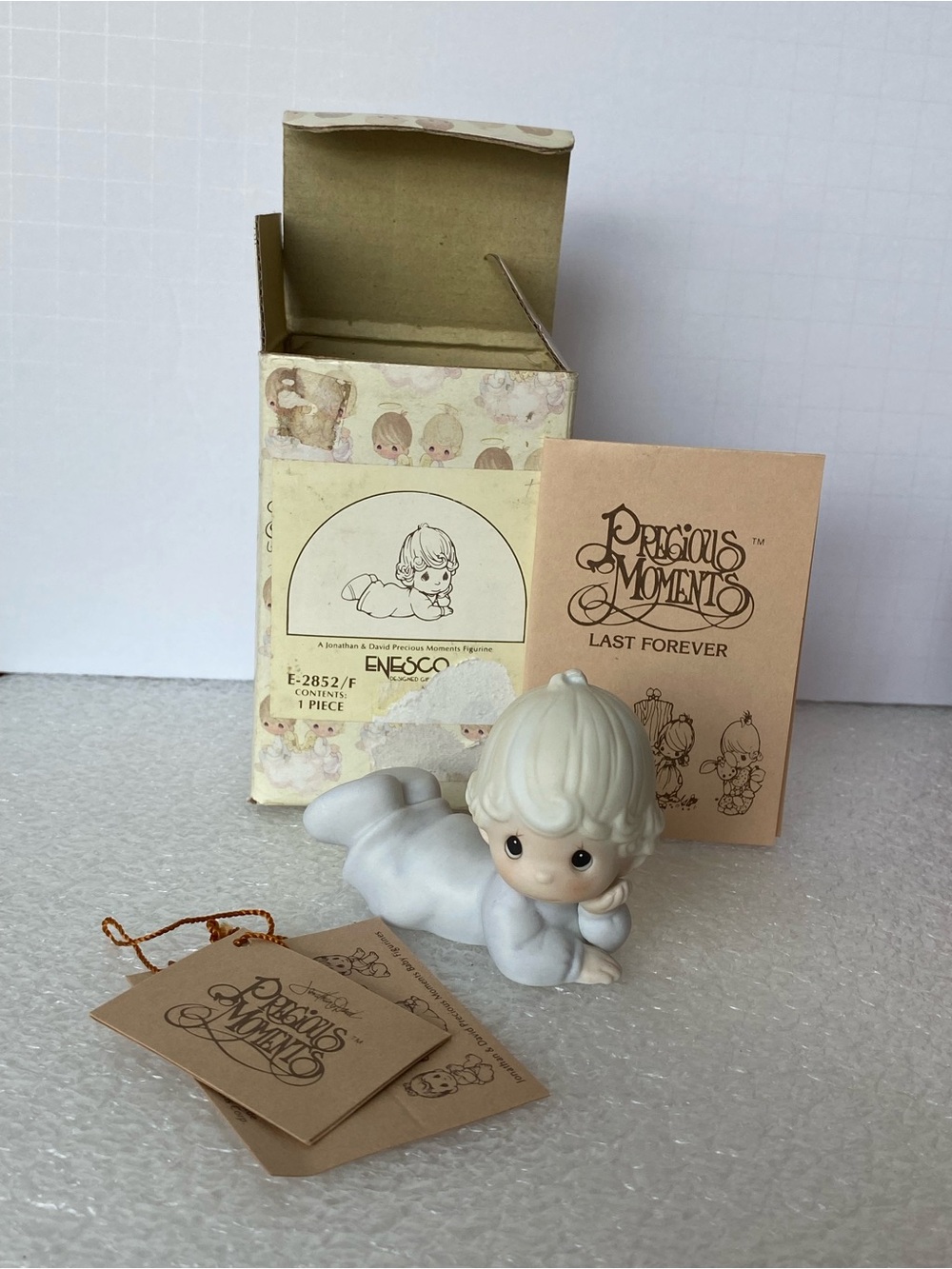 Vintage 1983 Precious Moments
E-2852/F Baby Figurine "Baby Girl
Laying Down"